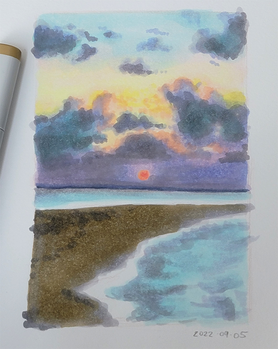 A marker photo study of a beach at sunset. The sky is purple with a bright red orange sun.