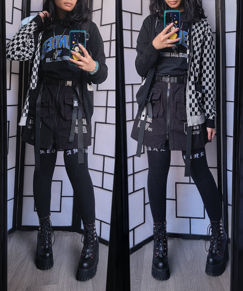 Grey and black techwear outfit with belt detail skirt and feather arrow pattern cardigan.