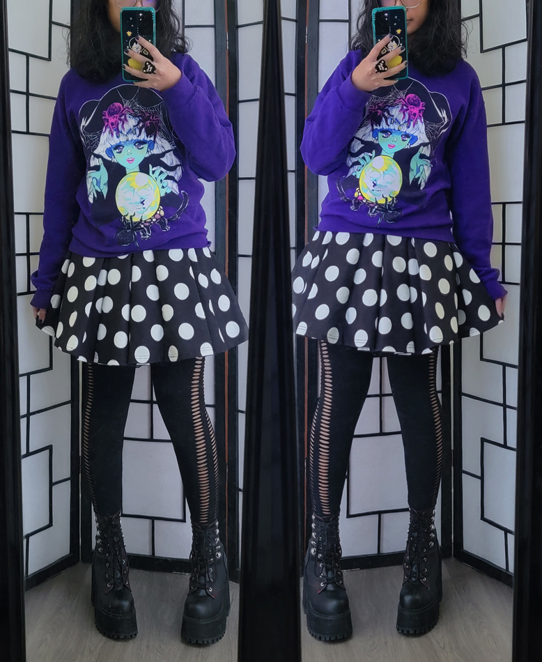 Witchy outfit featuring polka dot circle skirt and purple witch illustration pullover sweater.