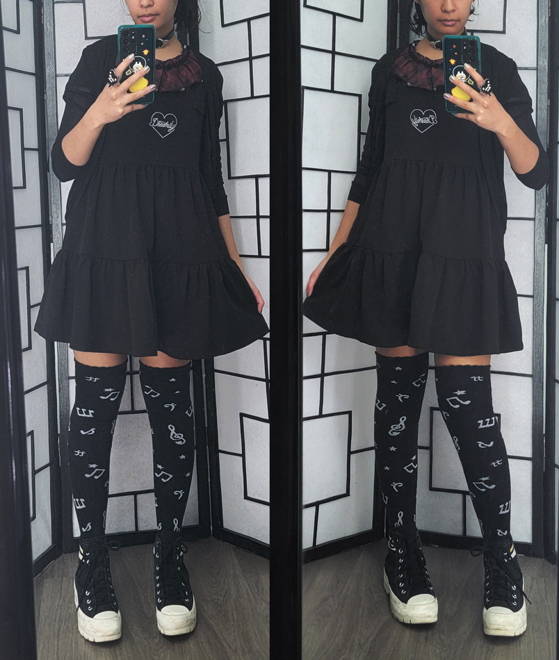 Casual dark outfit with ruffled tiered dress and music note socks.