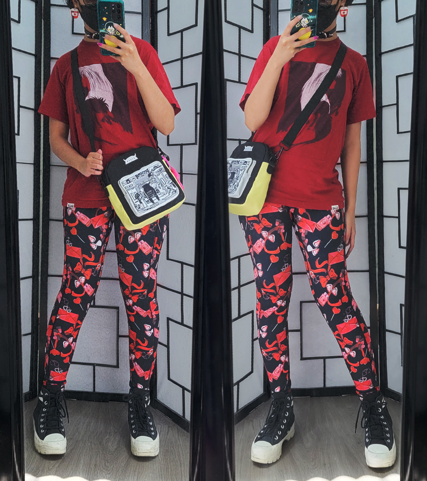 Casual red and black outfit with chocolate and valentine-themed leggings and anime shirt.