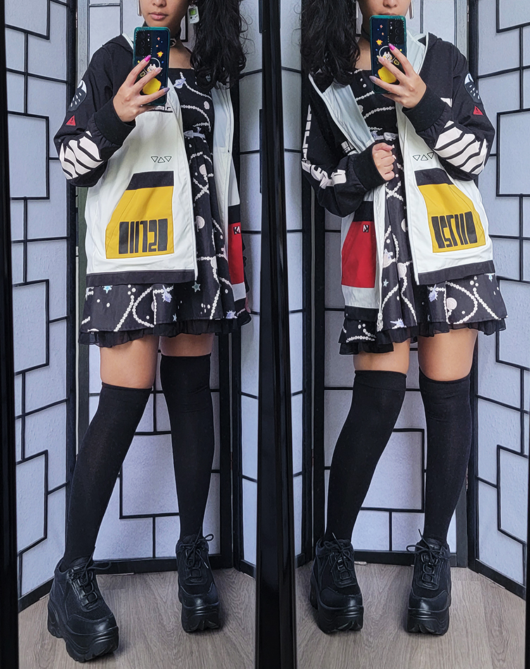 Simple black and white streetwear outfit with a seashell dress and techwear style color block jacket.