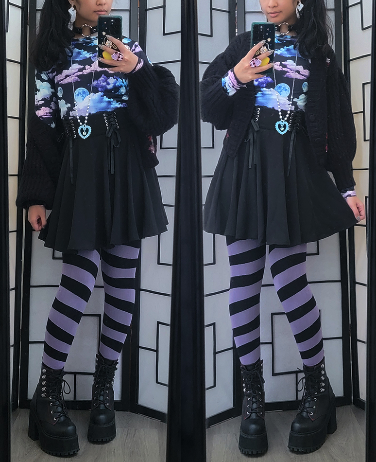 A black, purple, and blue dark girly kei outfit.