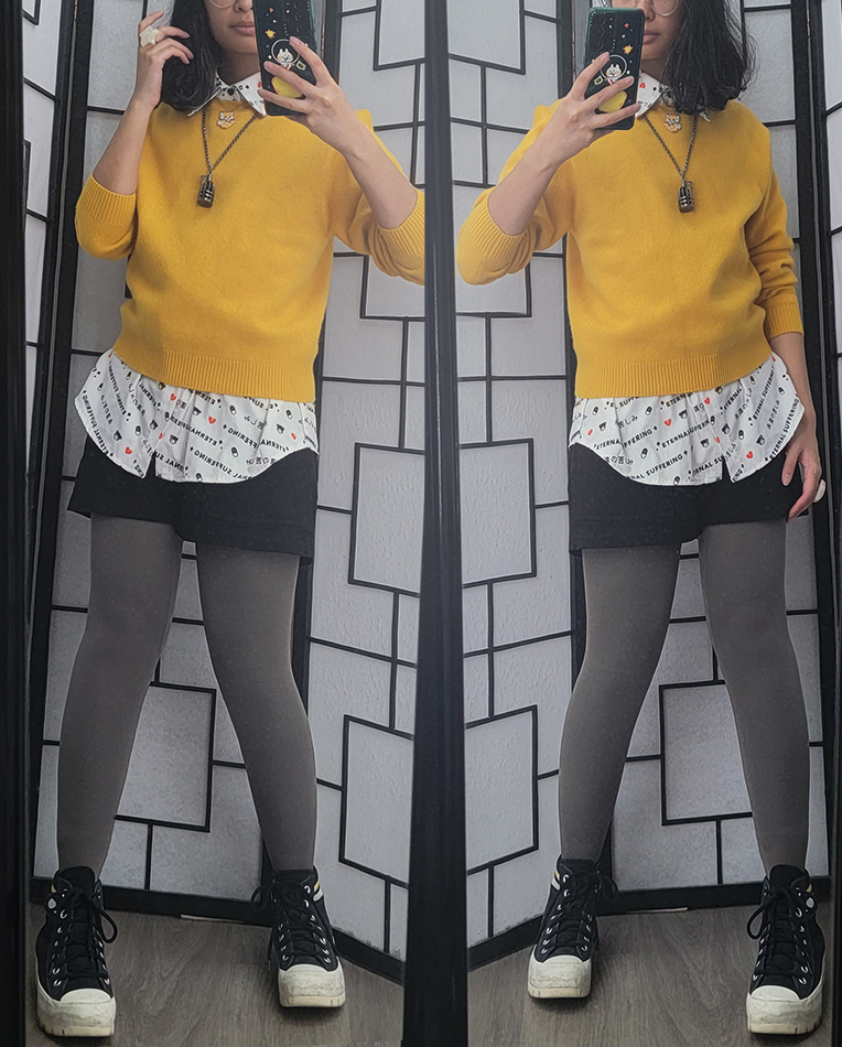A casual black, grey, white, and mustard yellow outfit.