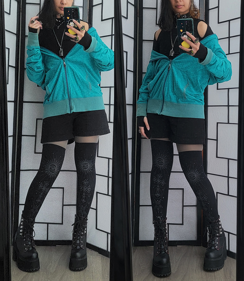 A teal and black visual kei style outfit.