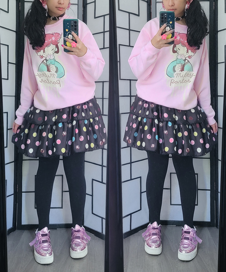 A casual bittersweet lolita coordinate with an oversized pink character sweater and polka dot print dress.