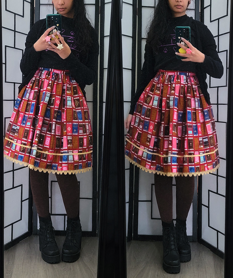 A casual black and red coordinate with a chocolate bar print skirt and anime graphic shirt.