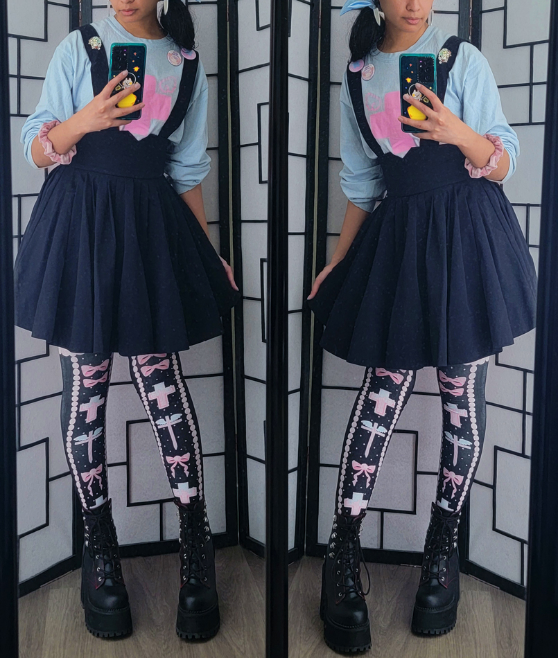 Pastel blue, pink, and navy outfit with cross motifs.