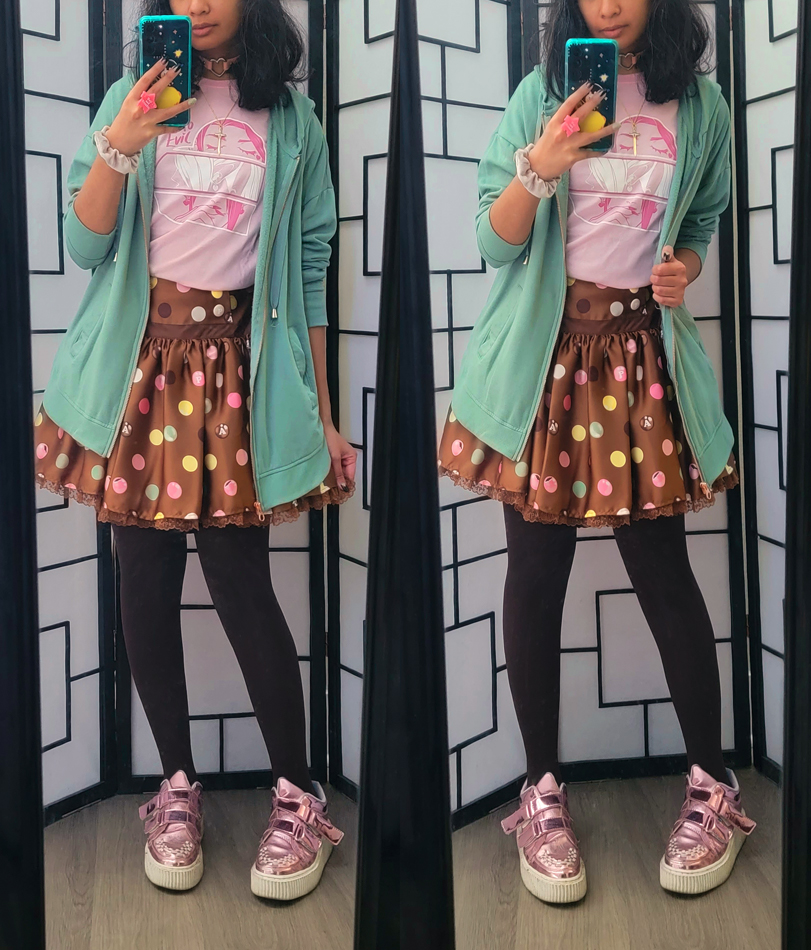 Mint green, pink, and warm brown outfit with heart motifs and chocolate candy patterns.