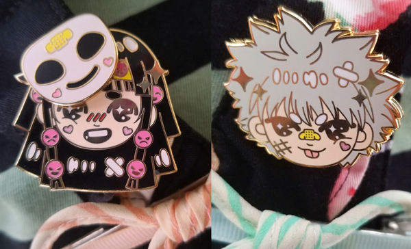 Detail photo of Alluka/Nanika and Killua character enamel pins.