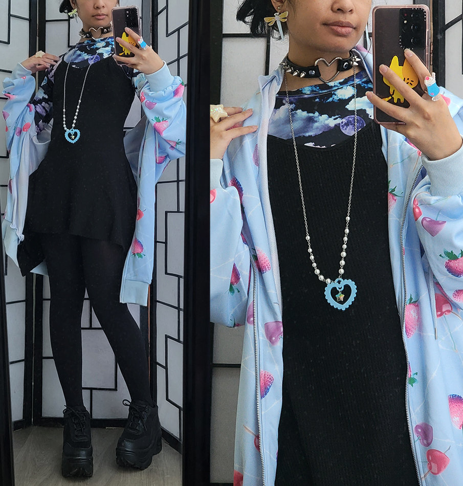 Black and pastel blue casual outfit featuring a strawberry print jacket.