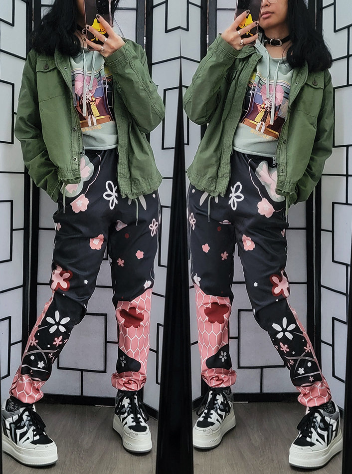 A black, pink, and green causal outfit featuring floral print joggers.