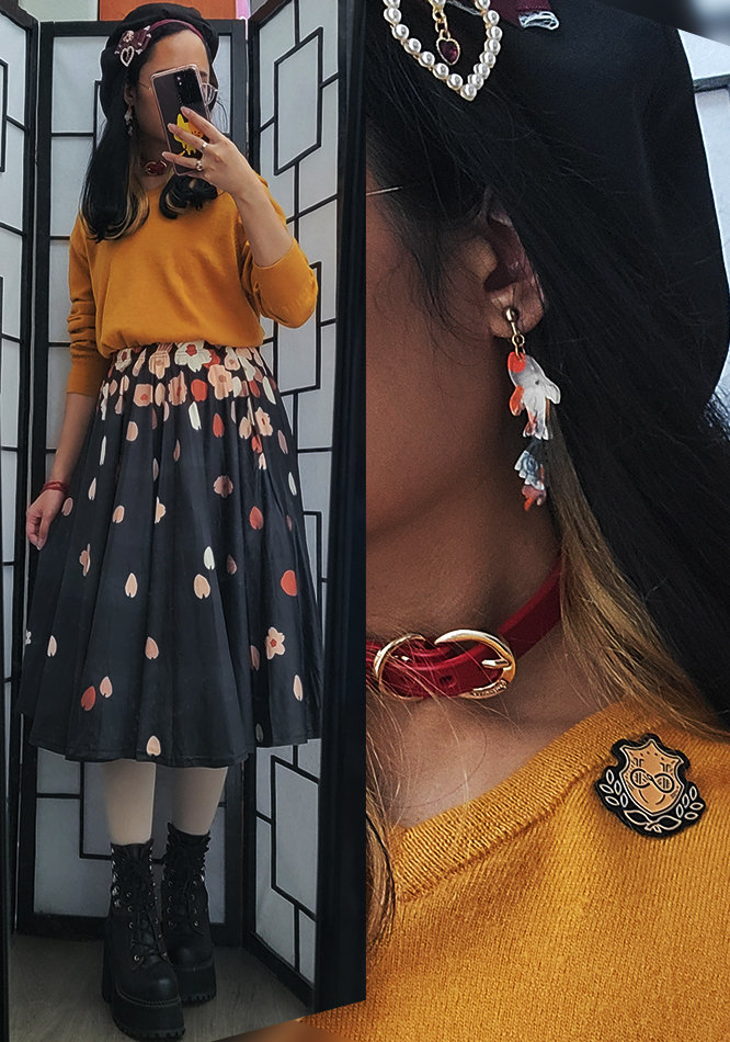 Casual mustard yellow, black, offwhite, and pink outfit featuring a falling sakura petal print midi skirt.