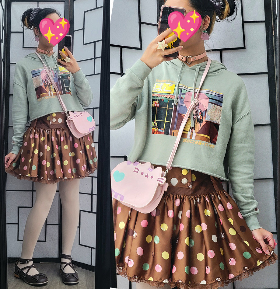 A green and brown casual lolita coordinate featuring a sage green hoodie with an anime girl illustration and a chocolate polka dot skirt.