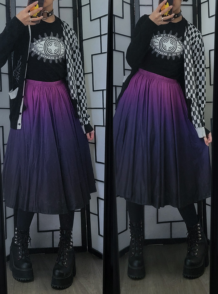 A black and purple casual outfit featuring a purple gradient midi skirt and an eye illustration graphic shirt