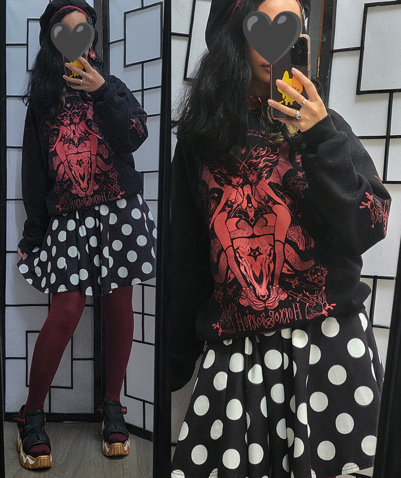 A black and red outfit featuring a horror print sweater and a polka dot circle skirt.