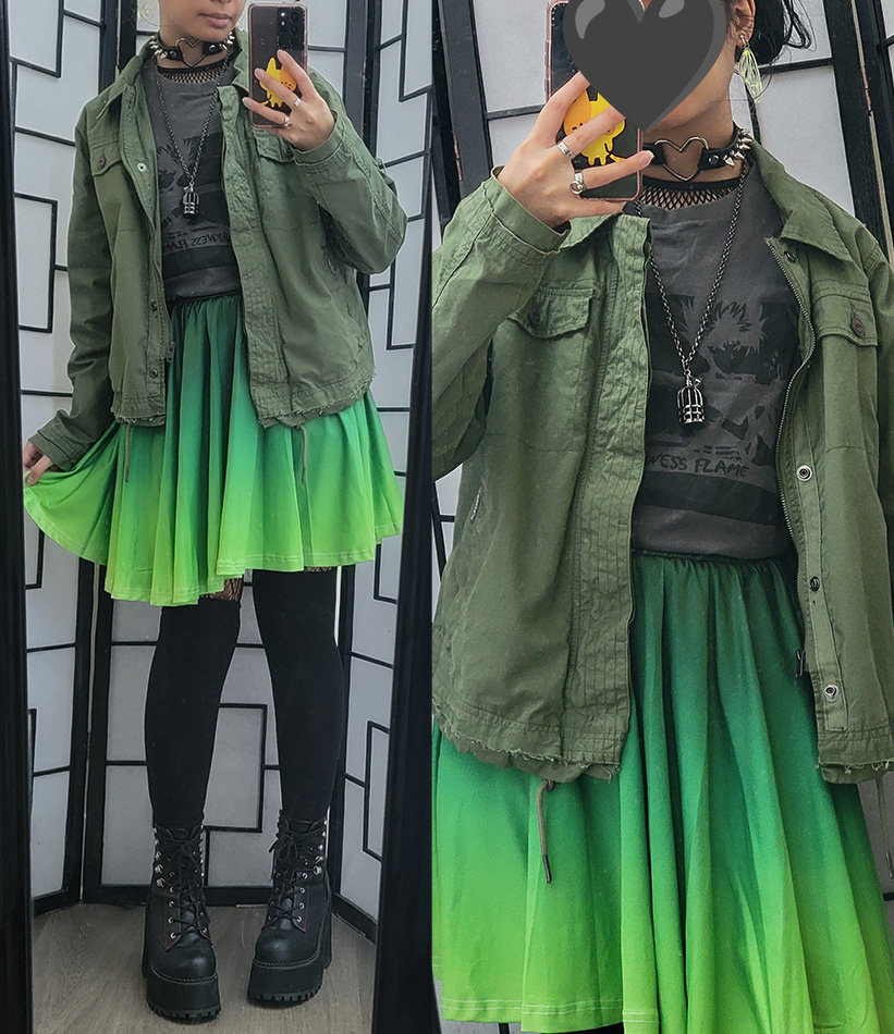 A green, grey, and black casual outfit featuring an anime shirt and a vibrant gradient green skirt.