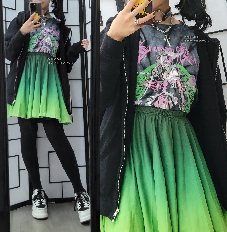 A casual outfit featuring a green gradient skater skirt and a Dark Magician Girl shirt.