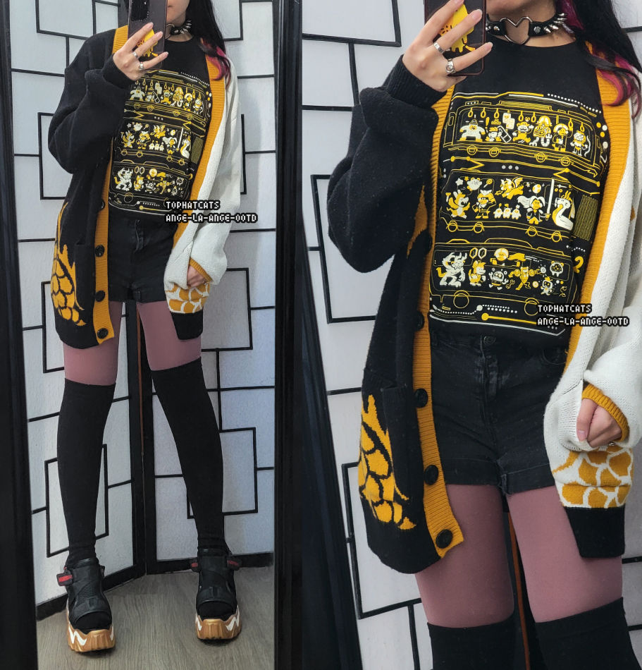 A casual black, white, and gold outfit featuring a Games Done Quick graphic shirt and split color cardigan.