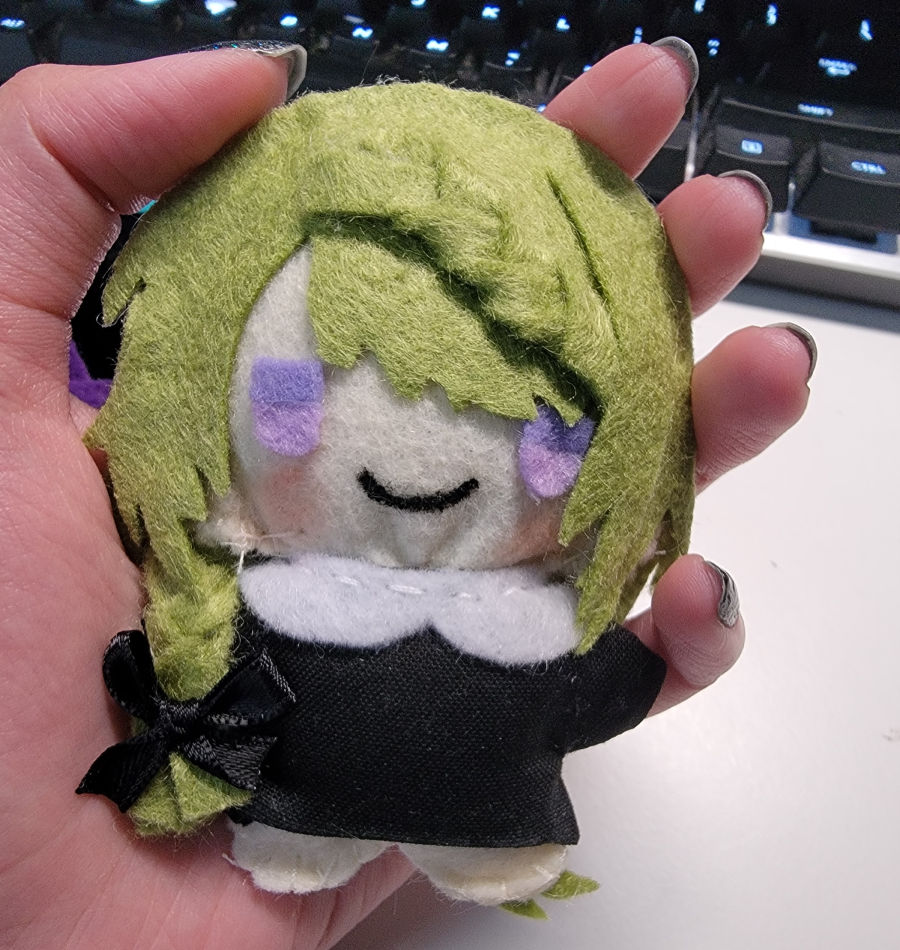 Dahut plush with hand for scale