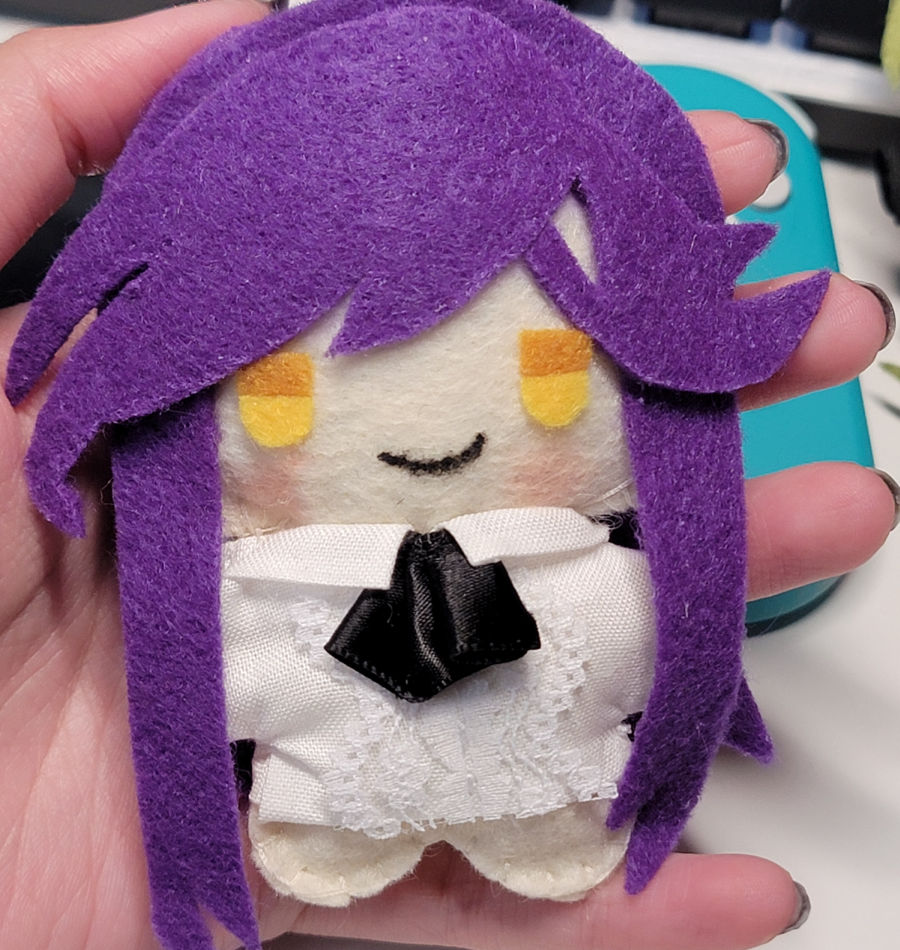 Mizuki plush with hand for scale